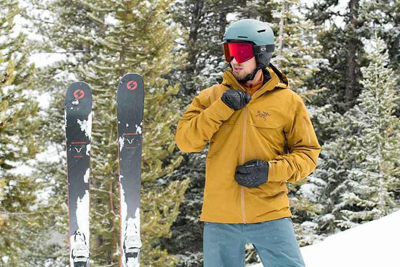 A skier zips up an ultra-comfy resort ski jacket. 