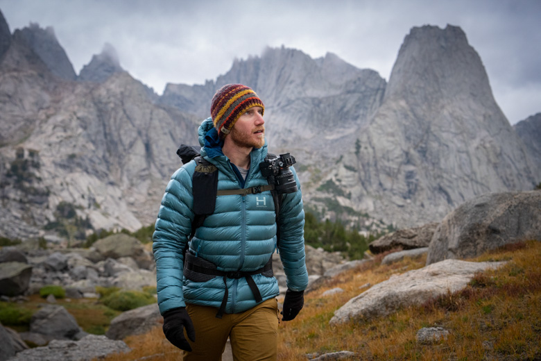 The author hiking in the Wind River Range of Wyoming with a camera at his shoulder