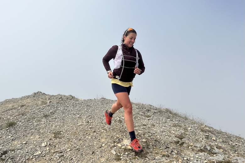 Running on a mountain top in the hoka speedgoat 2 trail running shoes