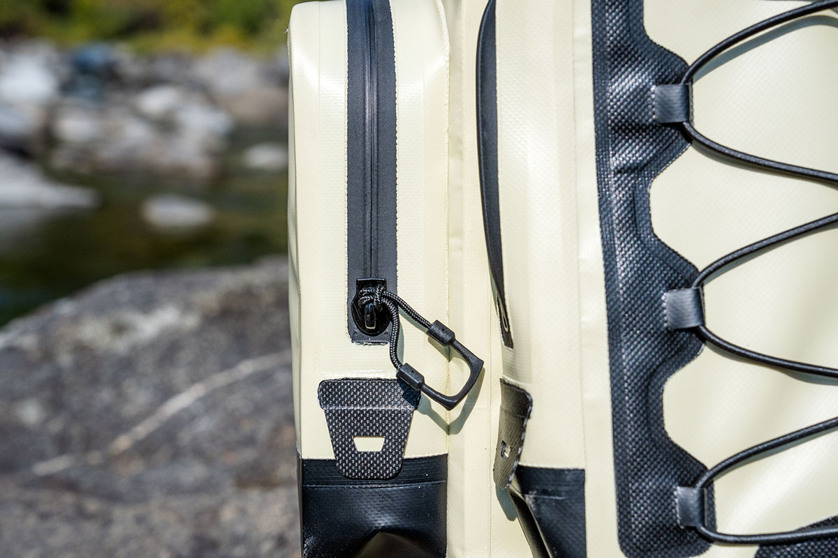 A close up shot of the waterproof zipper on a backpack cooler.