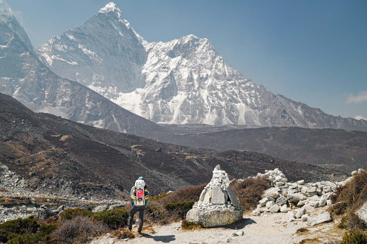 Climbing backpacks (facing big Nepal mountain)