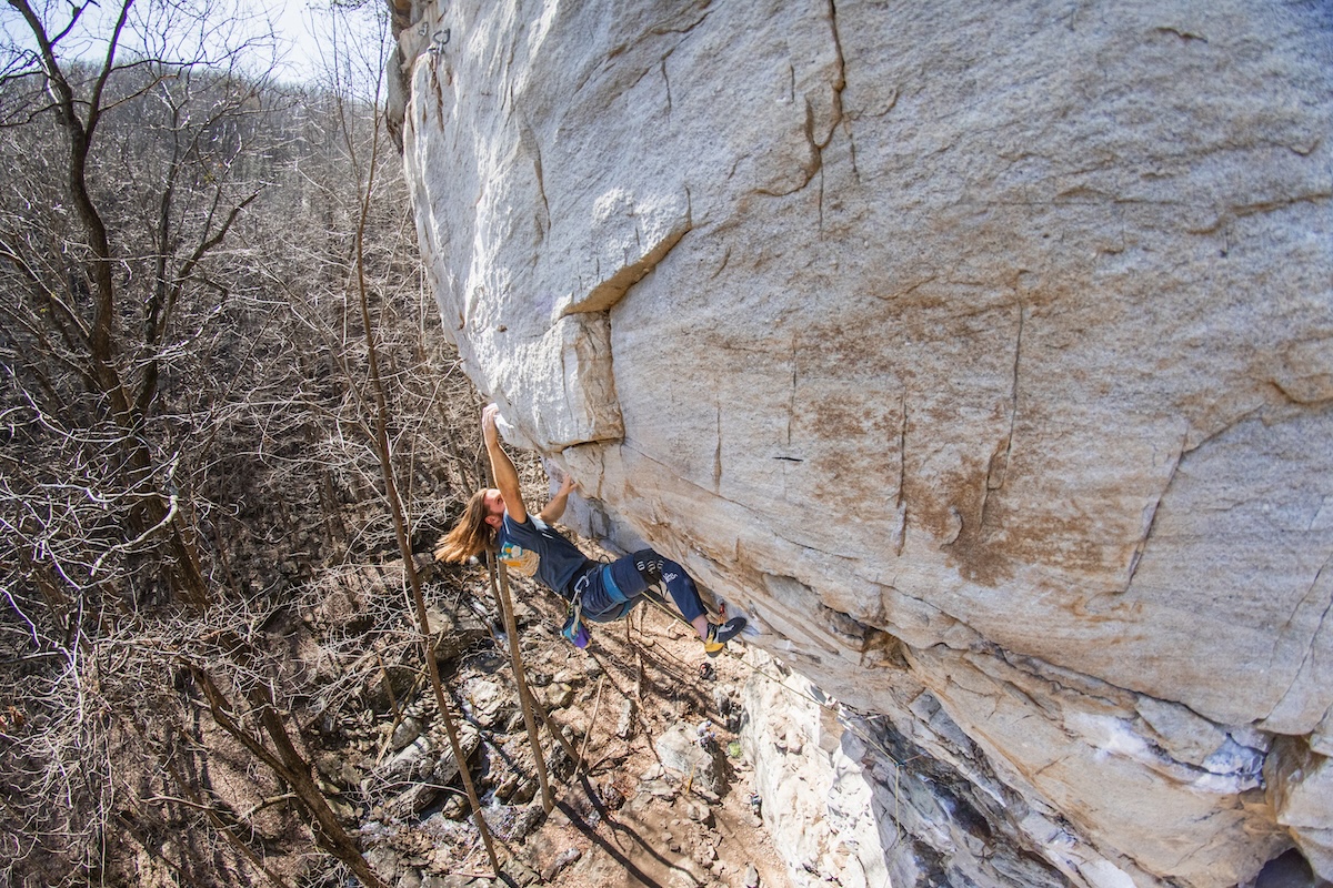 Climbing steep sandstone in the La Sportiva Solutions
