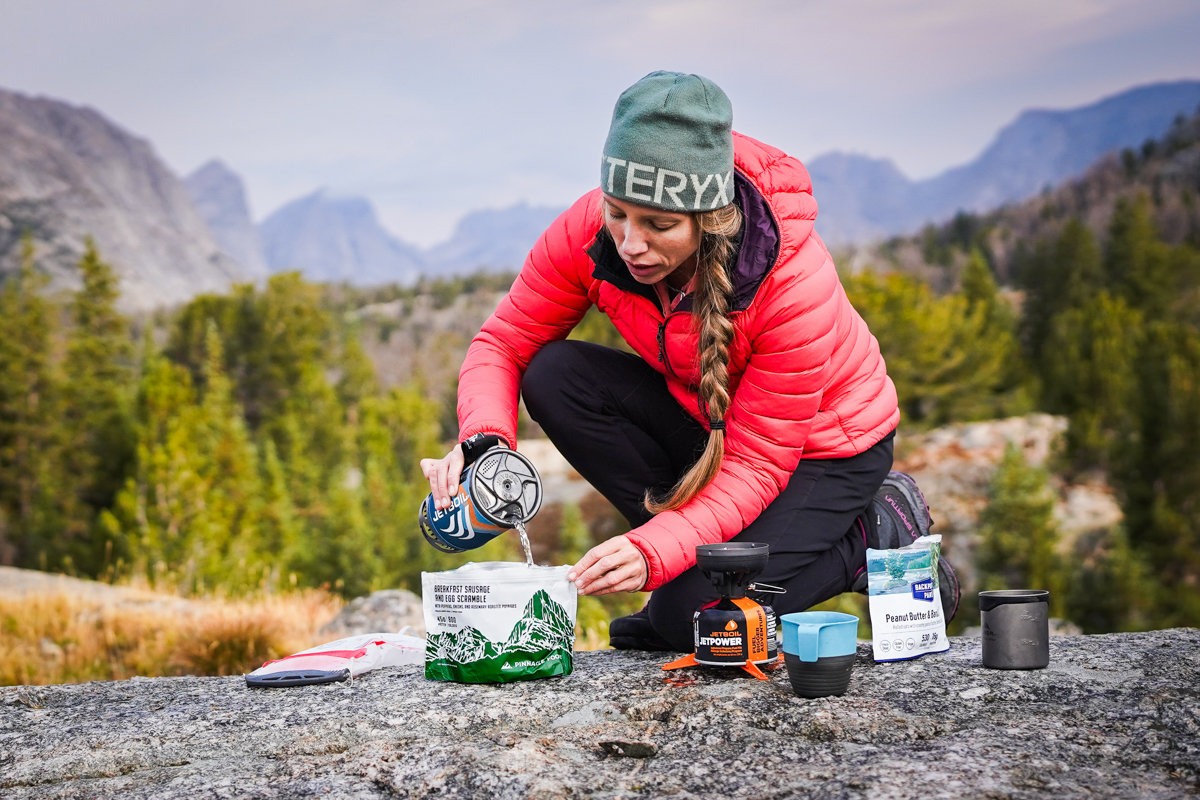 Backpacking meals (pouring water into pouch)