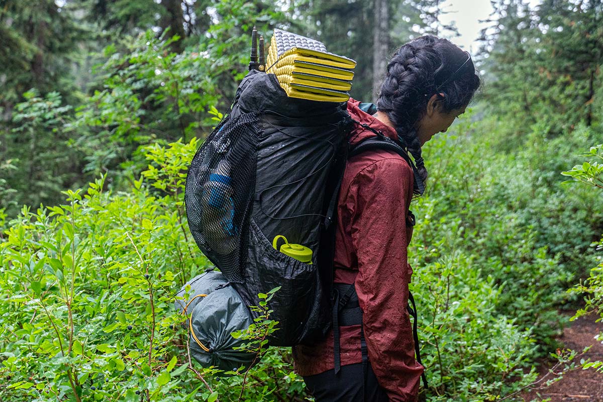 A woman backpacking with the Zpacks Arc Haul Ultra backpack