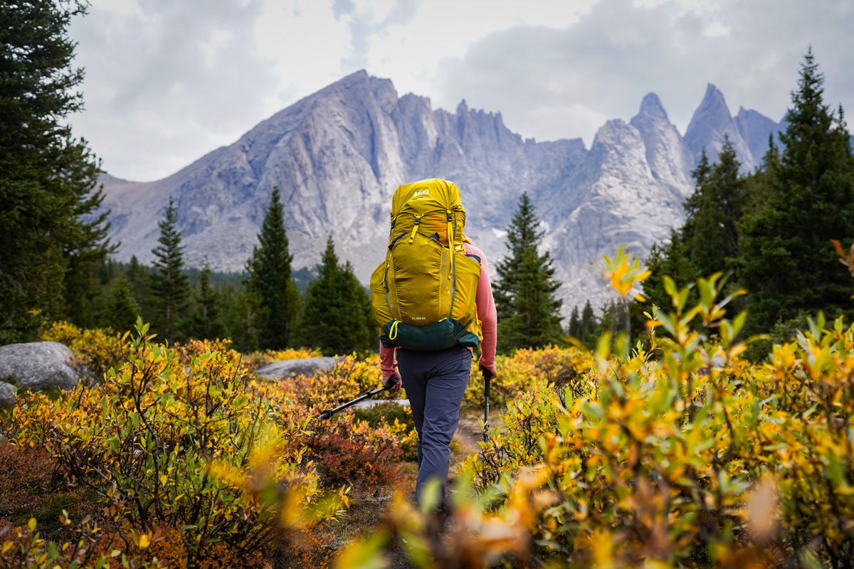 A woman hikes with an REI pack in the Wind River Range