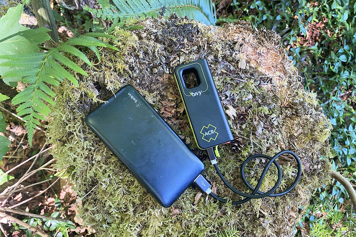 Bivy Stick satellite messenger charging on a power bank