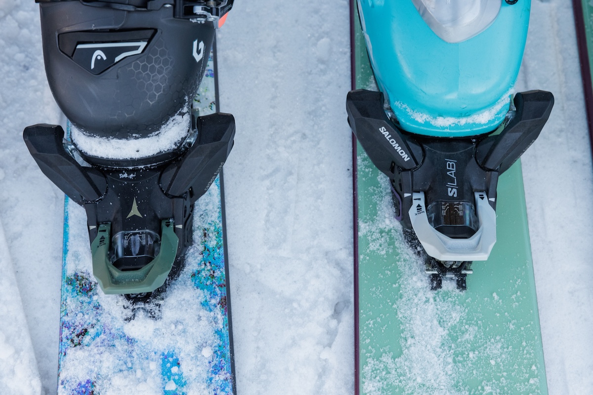 Two hybrid ski bindings shown close up and side by side