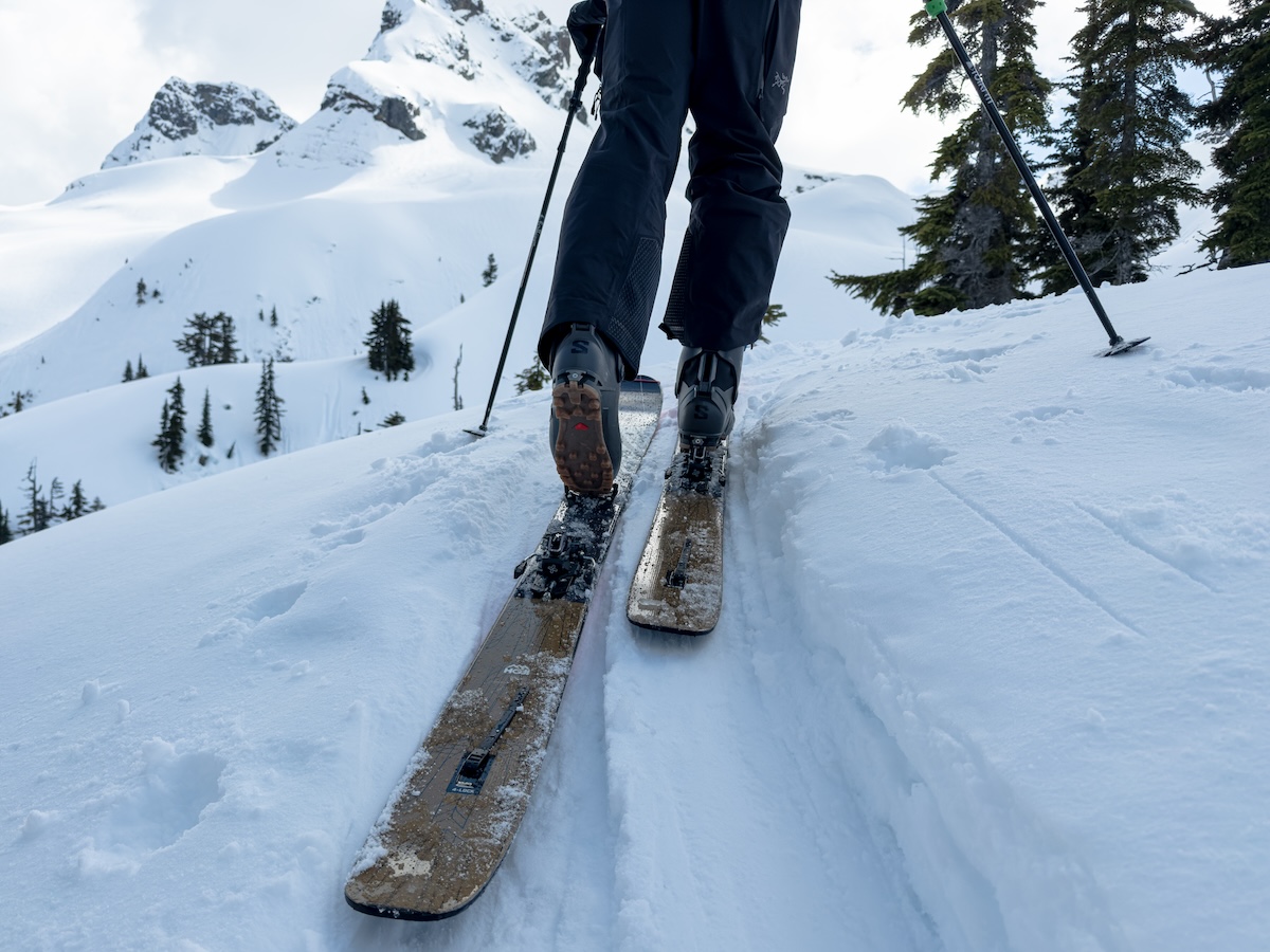 A skier climbing a mountain with backcountry skis