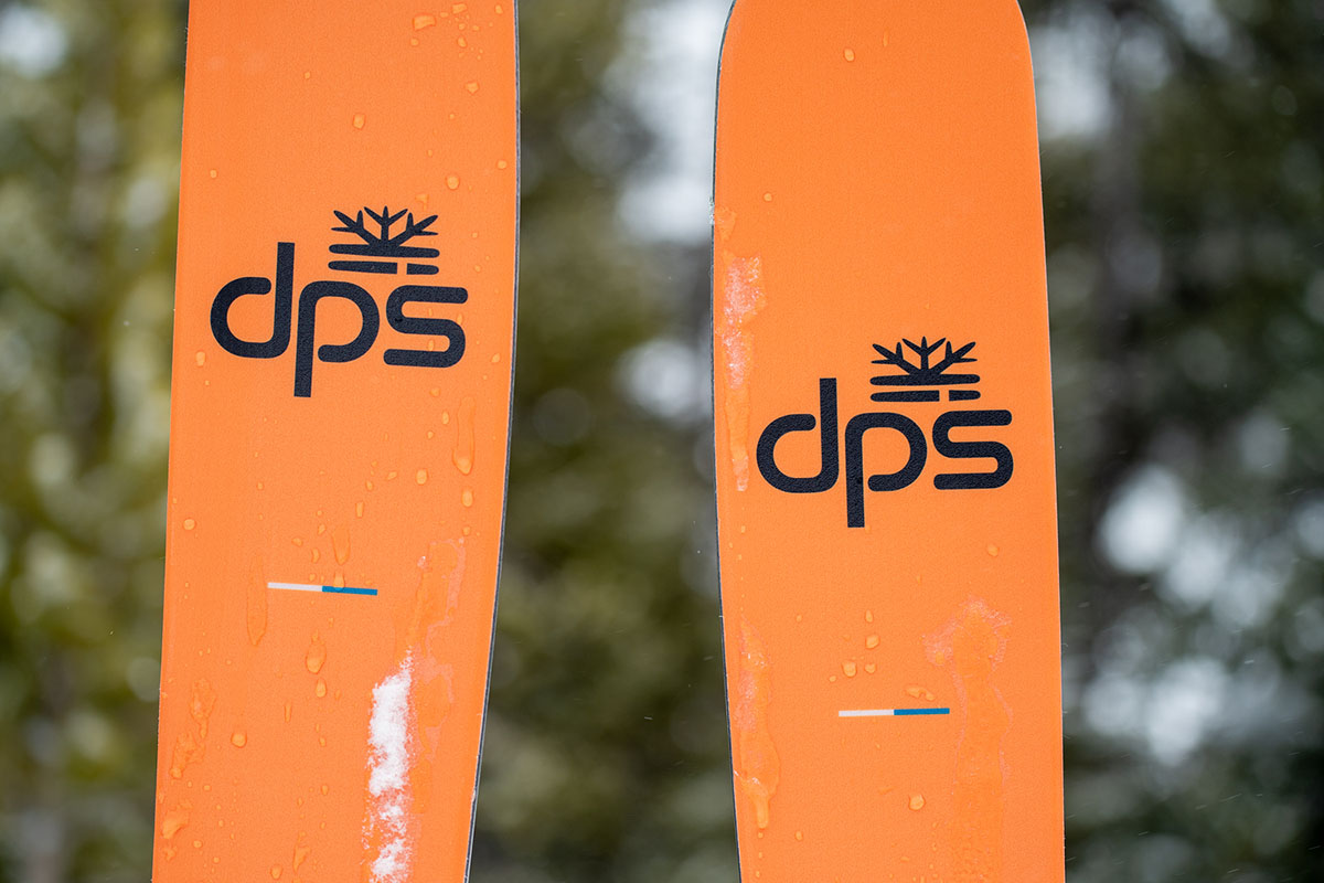 The DPS Pagoda Piste 90 RP skis have a bright orange base.