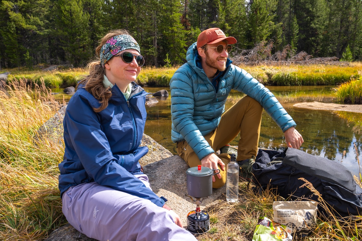 Cooking by a river with the Himali Accelerator Down Jacket
