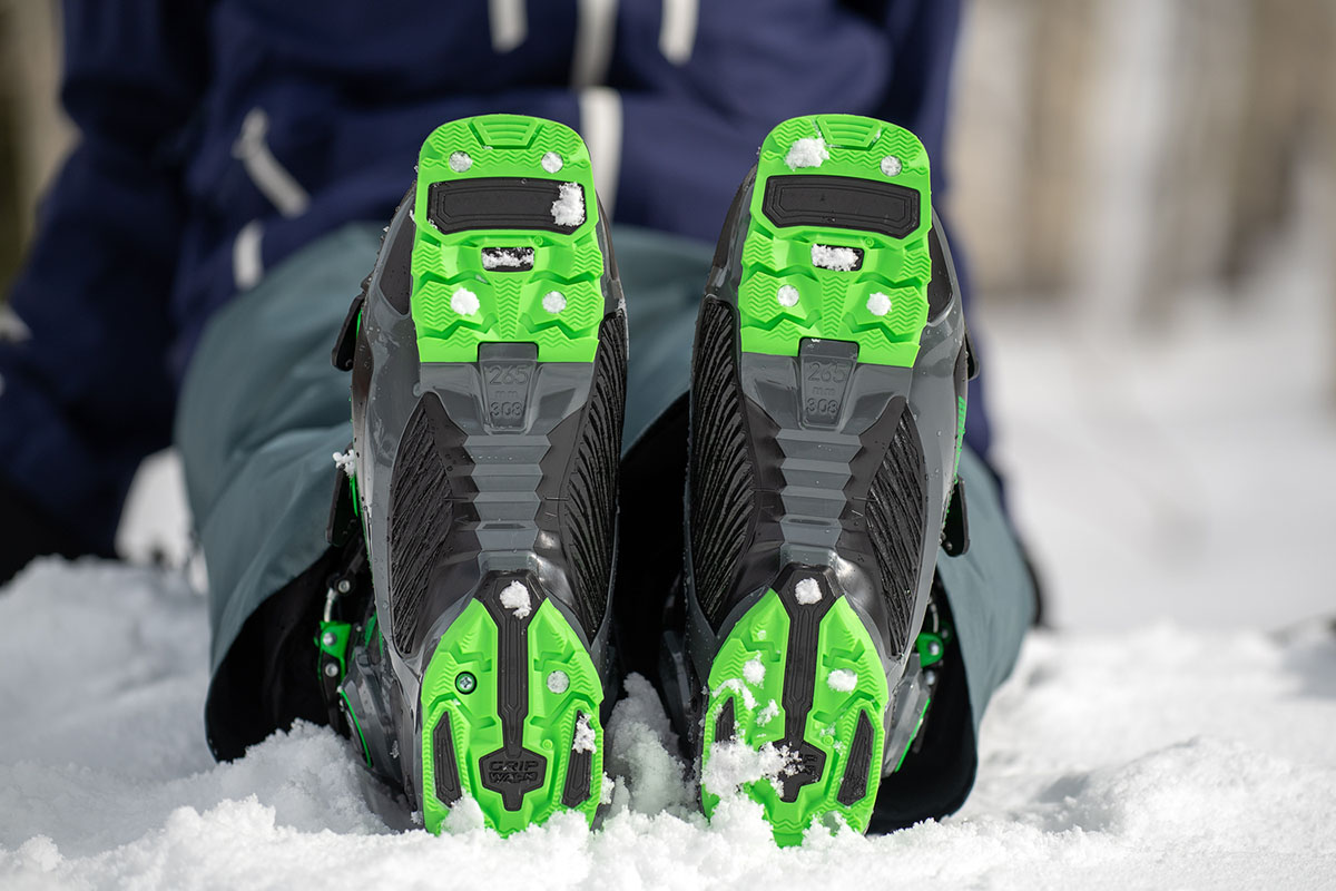 A close up of the gripwalk soles on a pair of ski boots.
