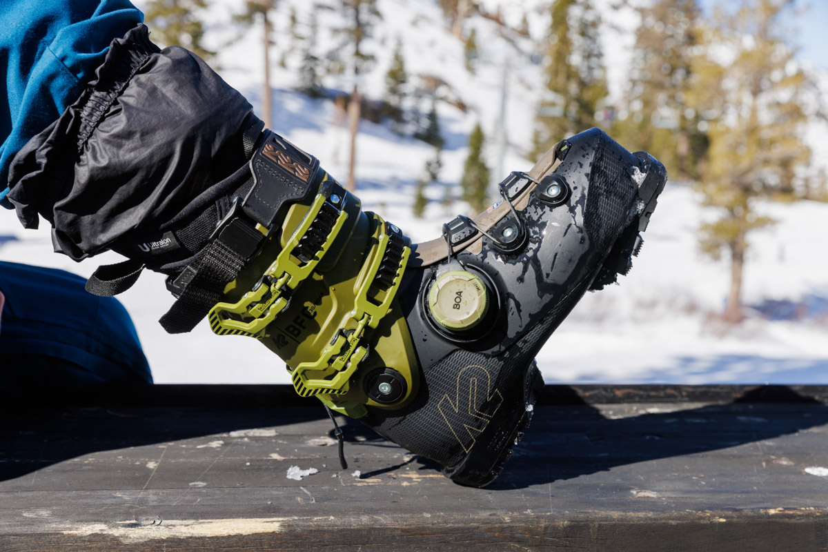 A black ski boot with a boa closure