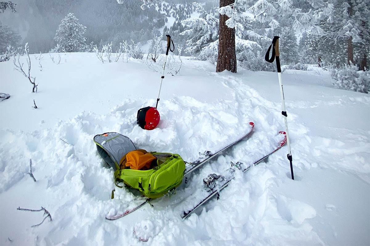 Ski touring gear sitting in the powder