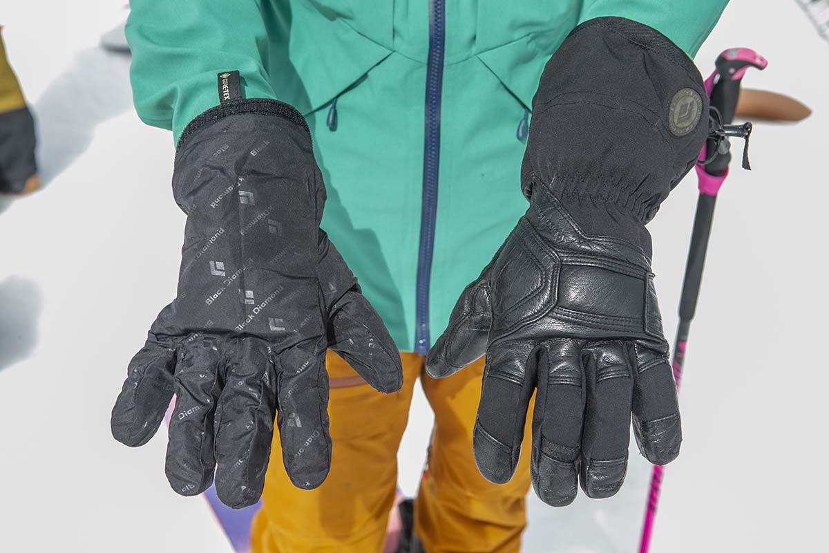 A glove liner and ski glove side by side