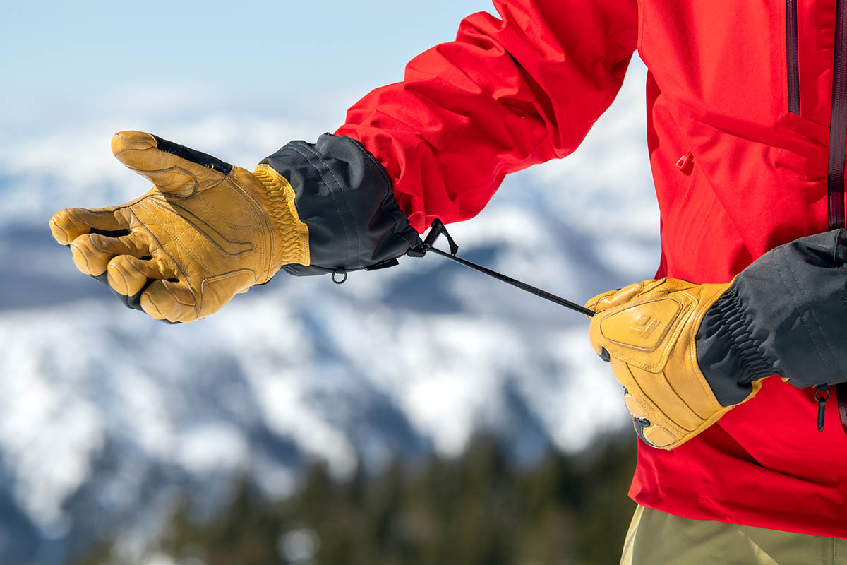 Pulling the cinch on a pair of ski gloves