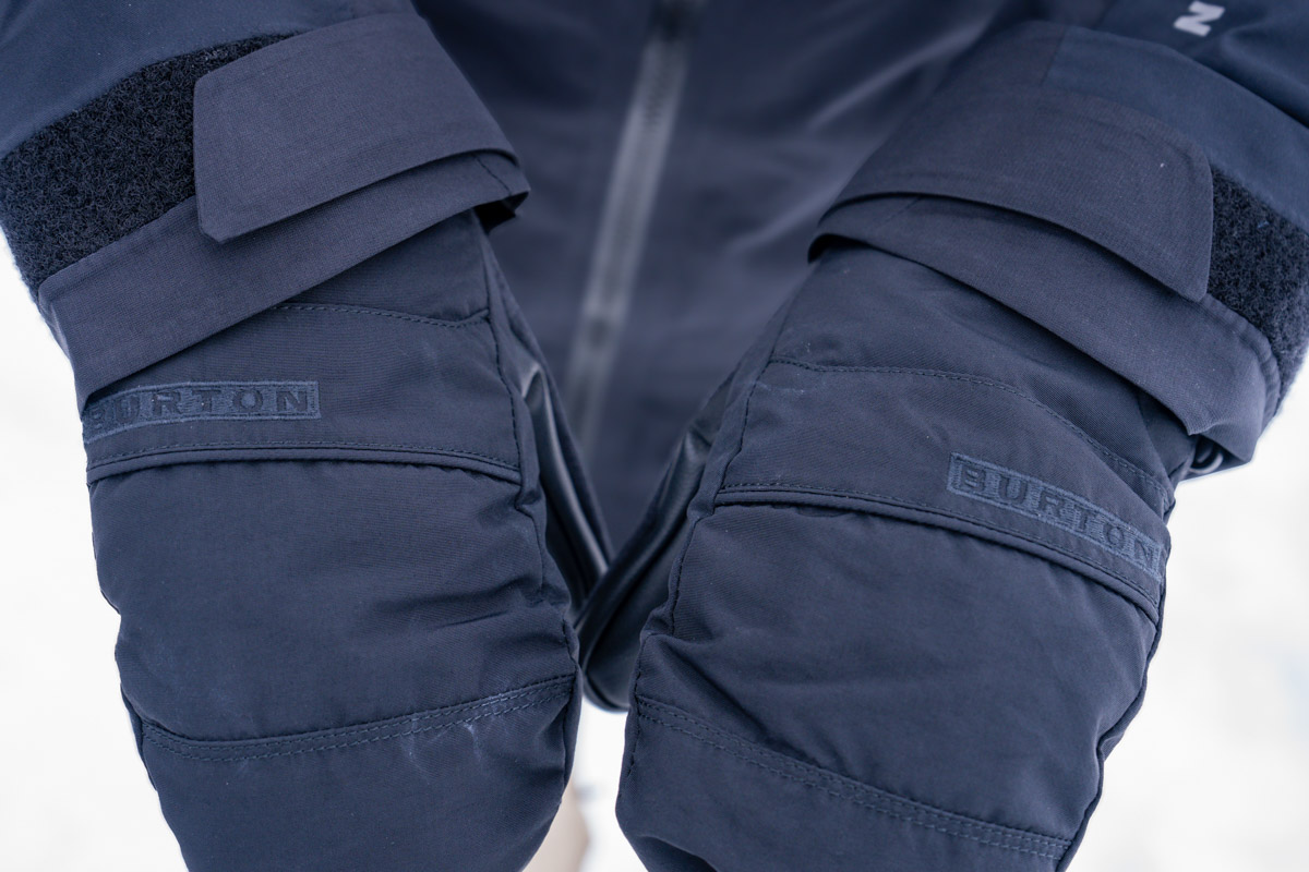 A close up of a pair of black ski gloves