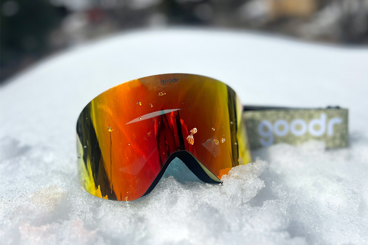 The Goodr Snow G goggles sitting on the snow