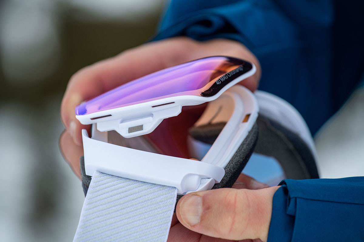 A close-up of taking the curved lens off the Smith 4D Mag goggle