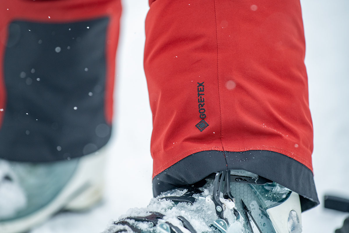 A close-up of the Gore-Tex logo on a pair of red ski pants