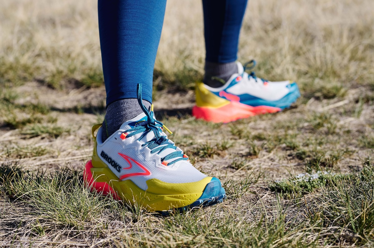 A pair of Brooks Caldera shoes sport bright, neon colors and rubber protection on the toes.