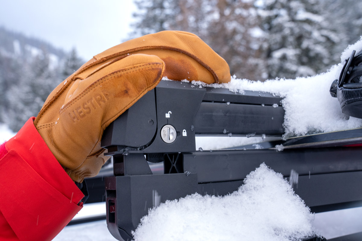 A leather winter mitten closing a roof rack