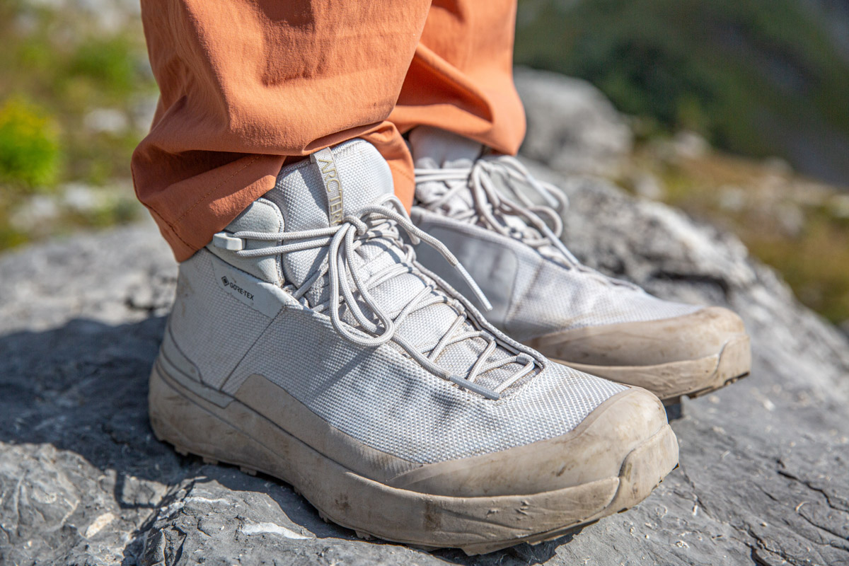 A close up of a pair of white hiking boots