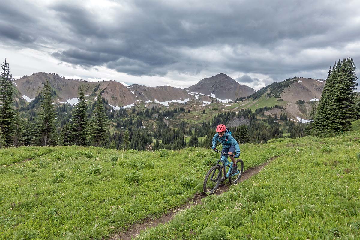 Biking in the Black Diamond StormLine Stretch women's rain jacket