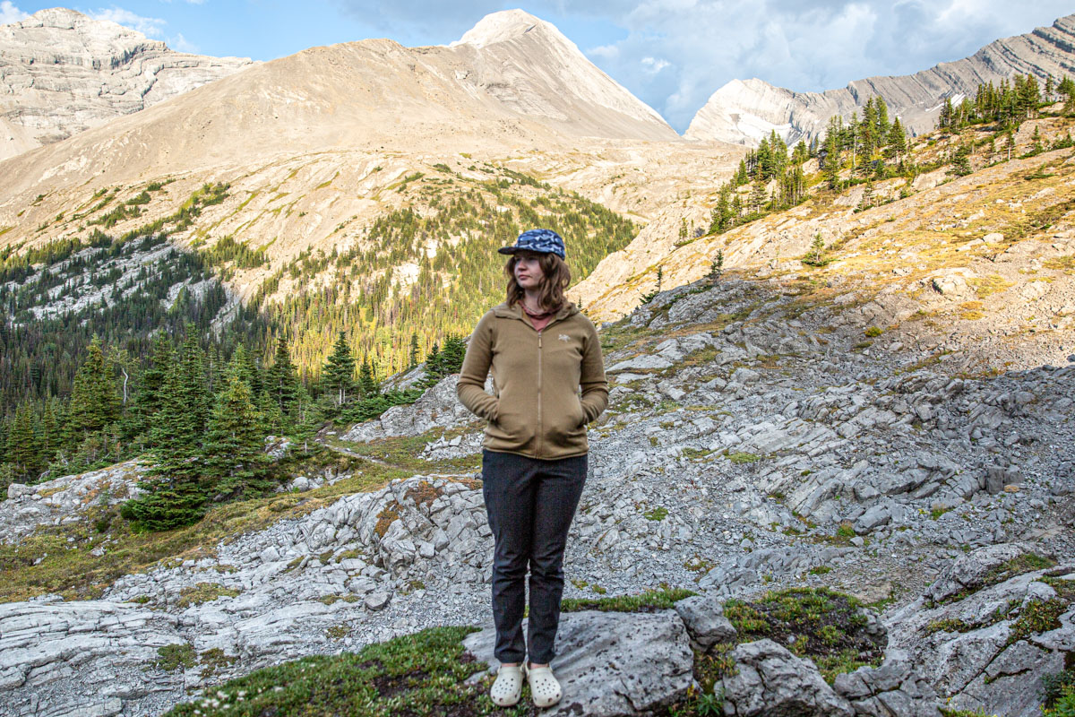 A woman standing with her hands in a fleece jacket