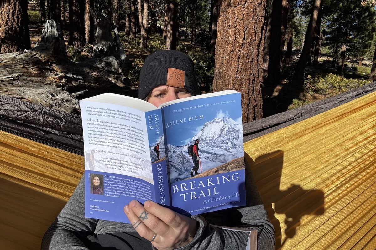 A women reads a book in a hammock