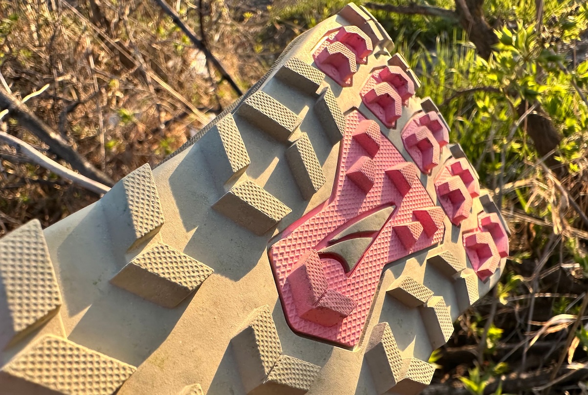 A close view of the outsole traction of a pair of hiking shoes in the sun