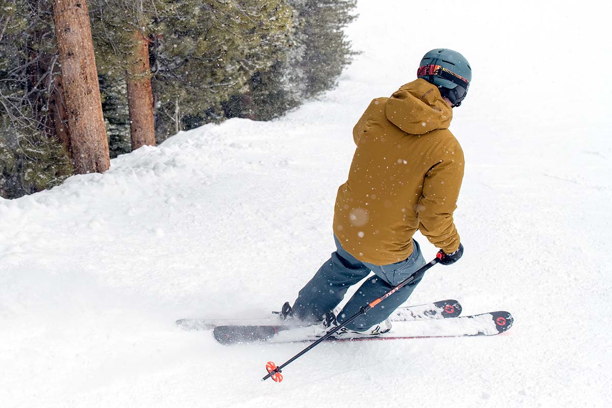 A skiier slides downslope in a comfy, winter-proof ski outfit.