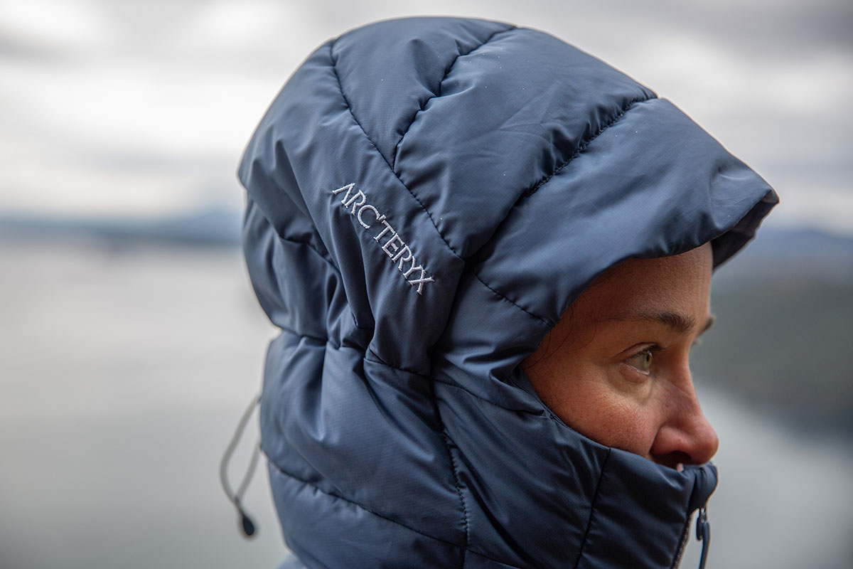 A tester demonstrated the high loft and snug fit of the storm hood design.