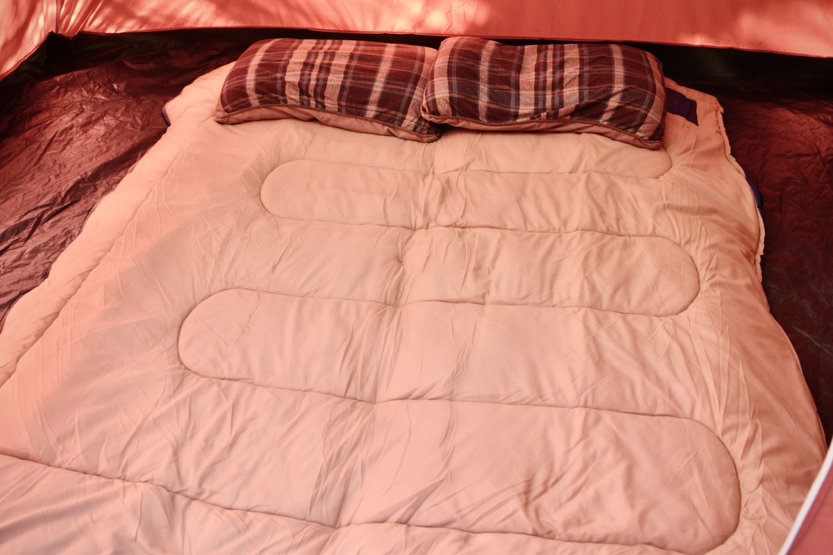 Showing the Coleman Brazos 20 fully unzipped like a quilt 