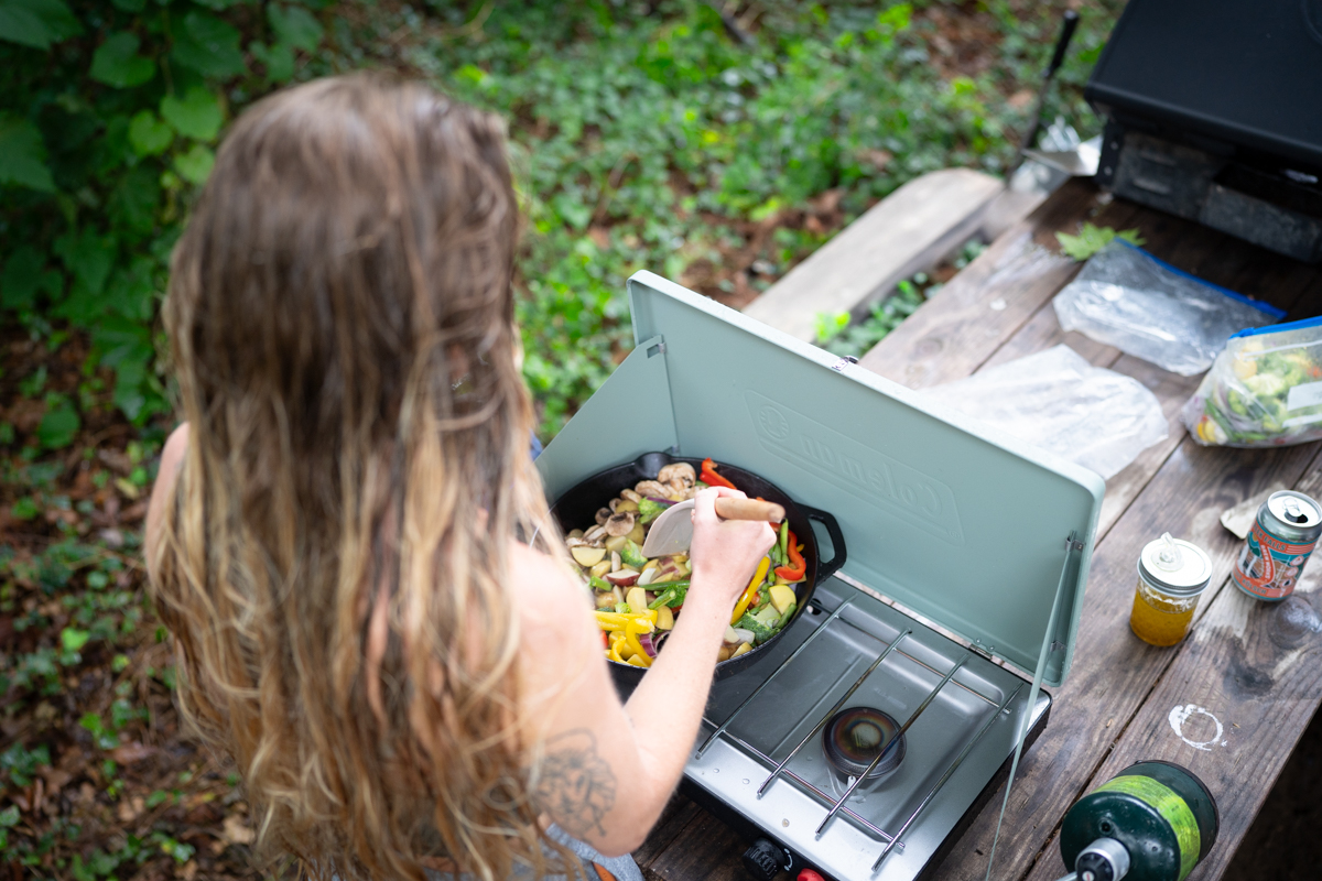 Looking down on a cast iron pan filled with a colorful stir fry