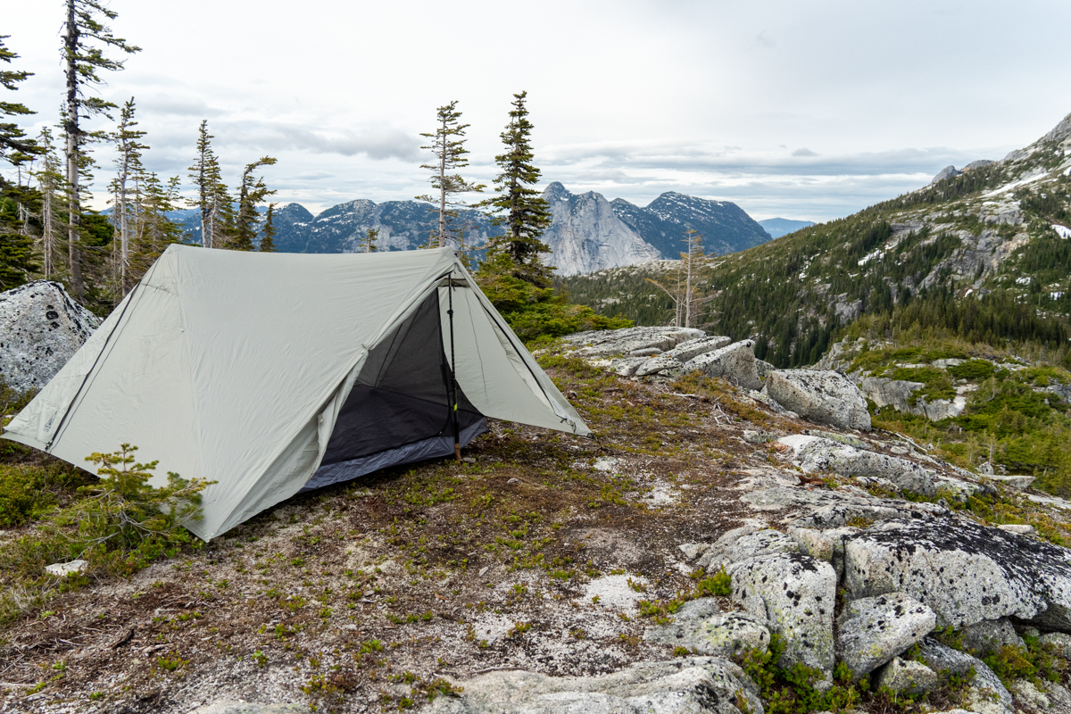 A backpacking tent set up in the alpine