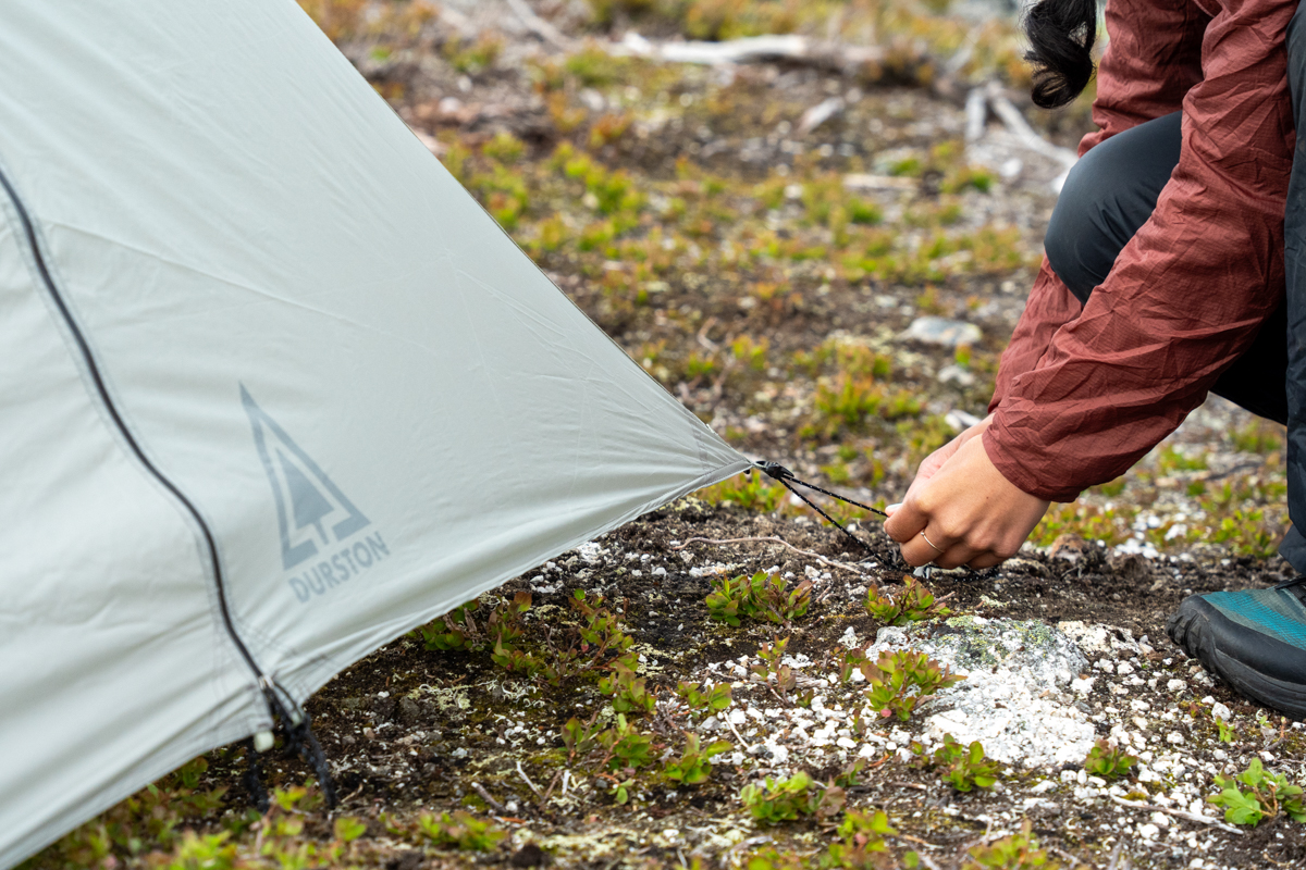 tightening down a backpacking tent
