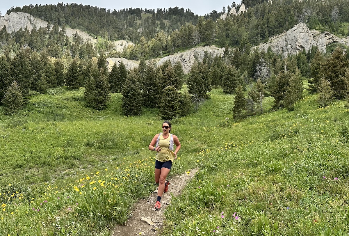 maggie slepian running hoka speedgoat 2 on a trail 
