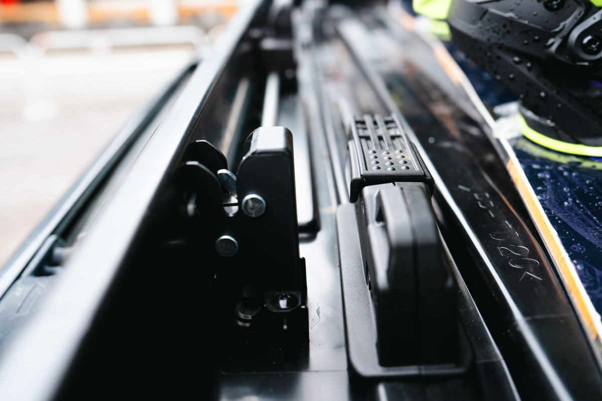 A close-up of the mounting system on the Inno Wedge roof box