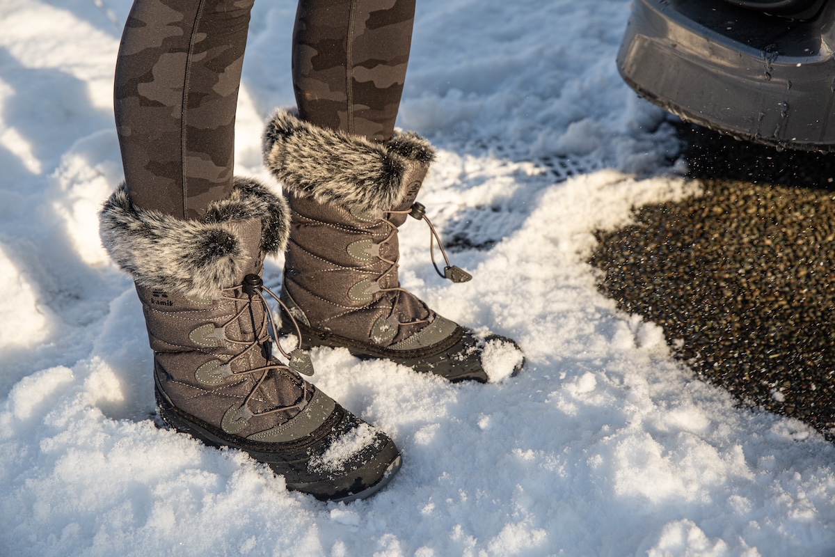Kamik Momentum standing in the snow