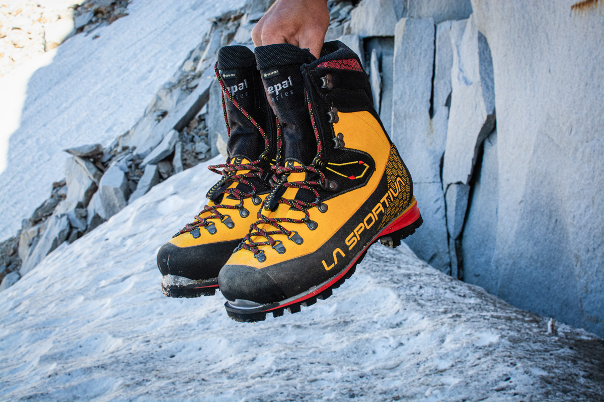 A man holds the La Sportiva Nepal Cube GTX boots