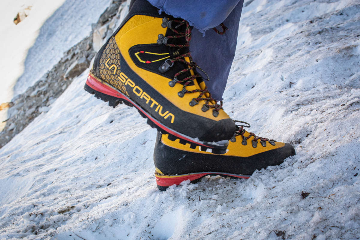 A closeup shot of the La Sportiva Nepal Cube GTX boots while hiking in snow