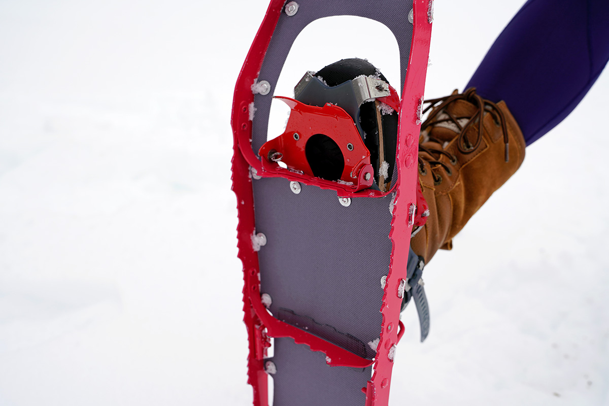 Showing off the crampons on the bottom of a snowshoe