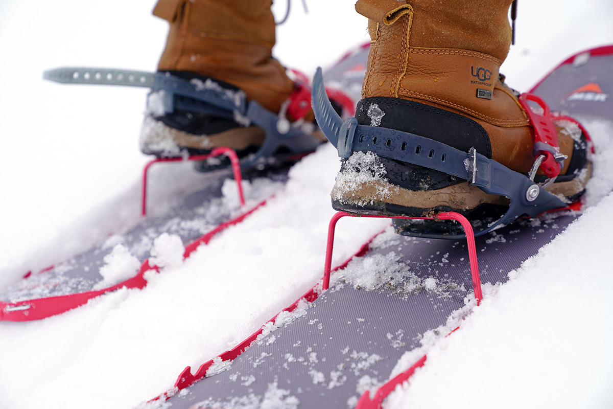 Close up of the heel risers on a pair of snowshoes