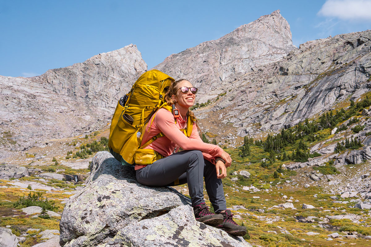 REI Co-op Flash 55 pack (sitting on rock)