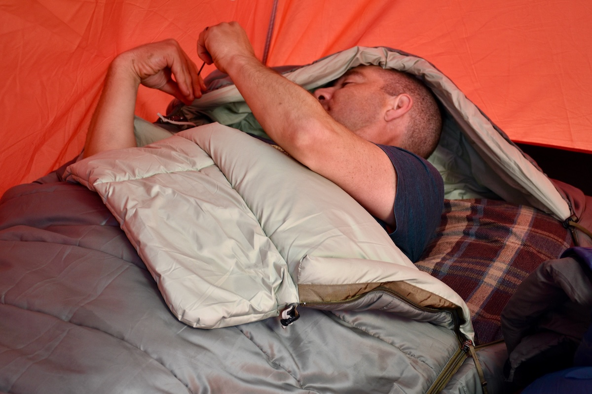 Adjusting hood on the Siesta sleeping bag