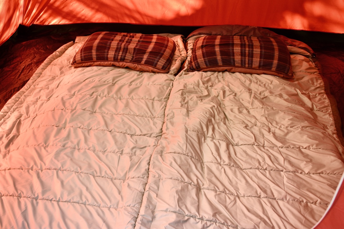 Showing the REI Siesta 20 fully unzipped like a quilt