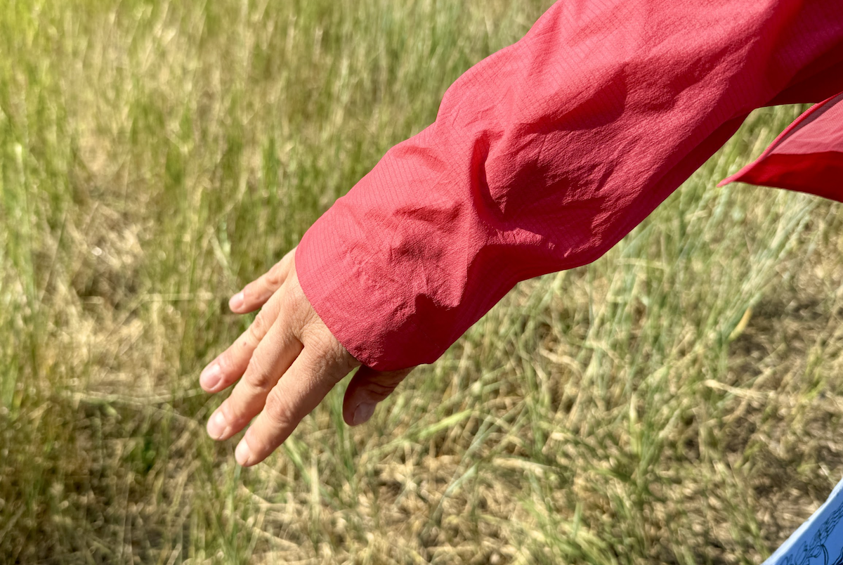 a view of the cuffs and sleeves of a pink rain jacket