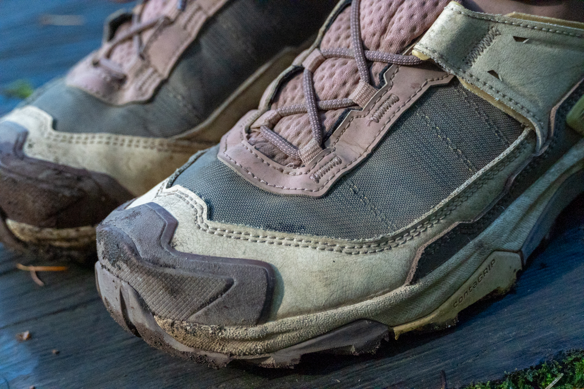 Close up of the front of a pair of brown and pink hiking boots