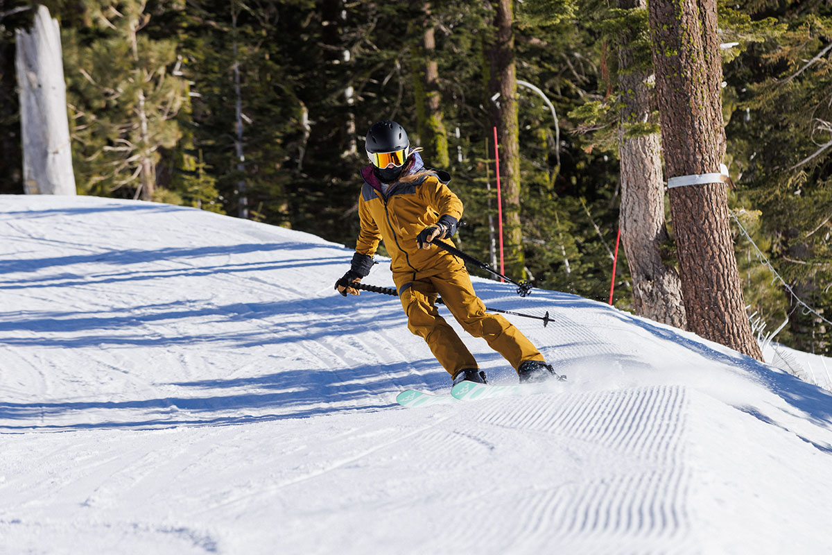 Trew Gear Asotria Bib (skiing at edge of run)