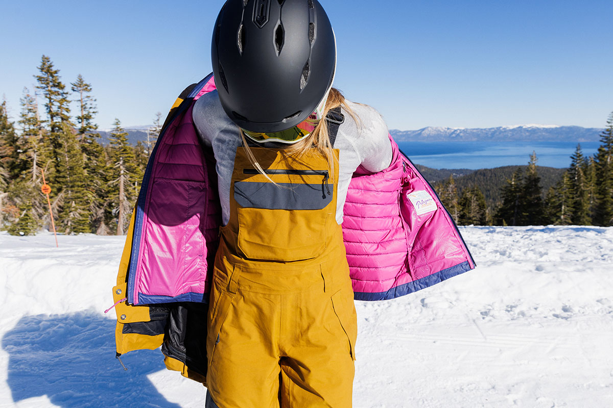 Trew Gear Astoria ski bib (taking jacket off)